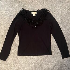 Black v-neck sweater with ruffle feathers